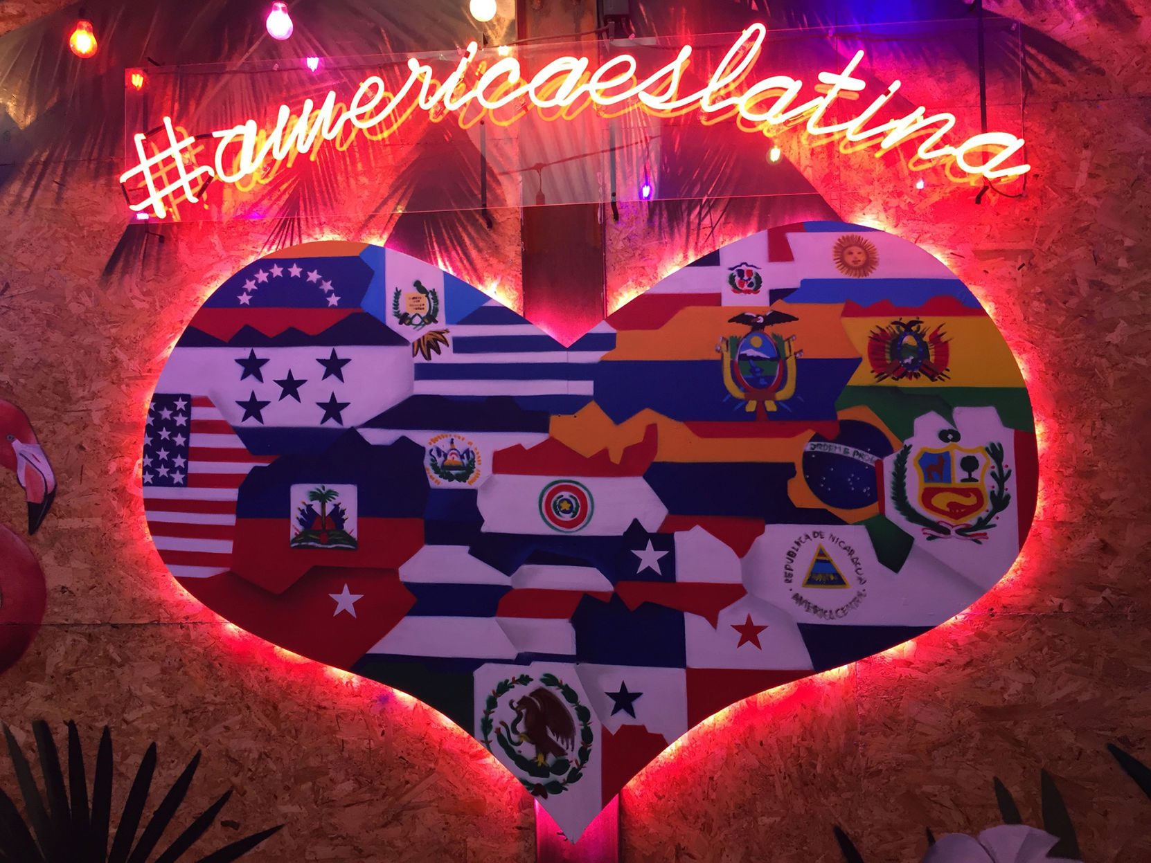 Neon murals decorate Comedor de los Milagros, Roma Sur's popular food court and bar serving international cuisines that show off Mexico City's place as a center of Latin American culture.